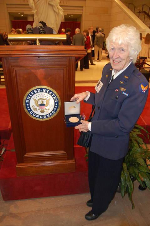 Lois Nash holds her Gold Congressional Medal