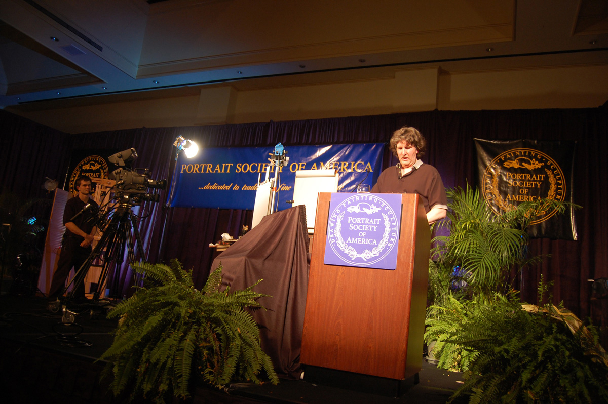 Tom Nash speaking at podium